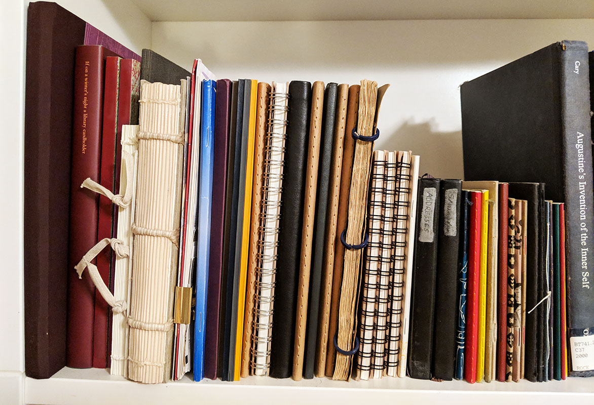 Bookshelf of notebooks